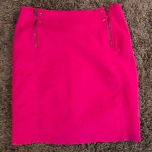 Hot pink pencil skirt W/ front zippers and studs.